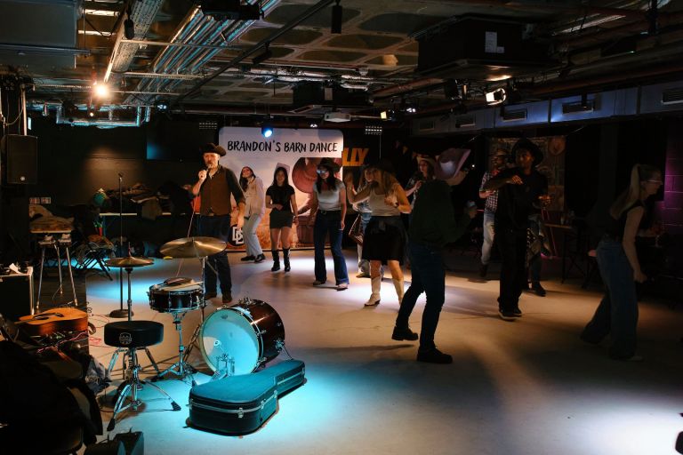 Corporate group enjoying a line dancing team building session in London